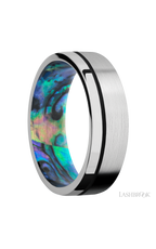 7 mm wide/Flat/14K White Gold band with one 0.5 mm Off Center inlay of Black also featuring a Abalone sleeve.